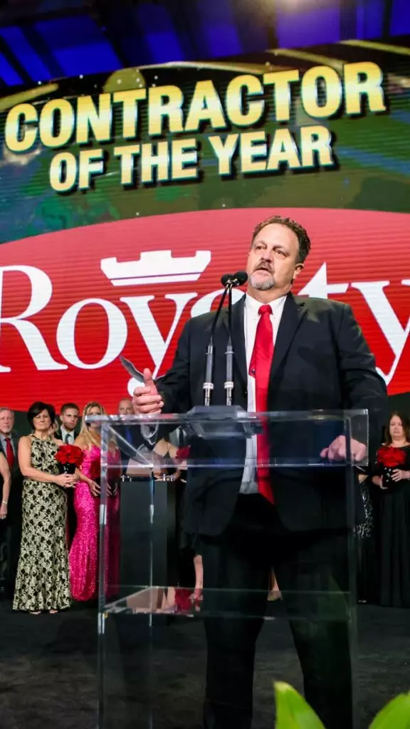 Andy Royalty giving speech after Royalty Roofing selected as contractor of the year