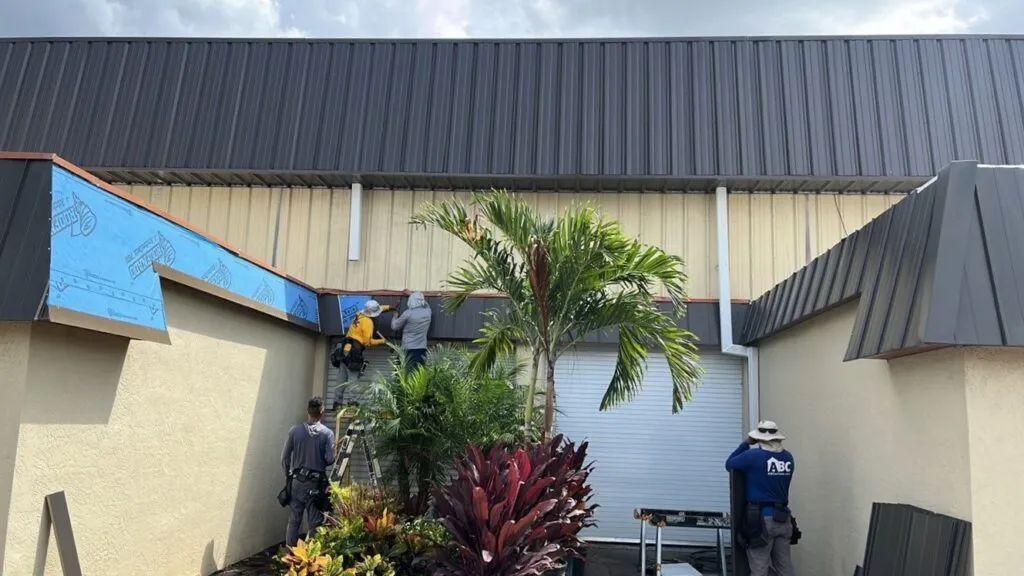 royalty roofers replacing metal roof on a business