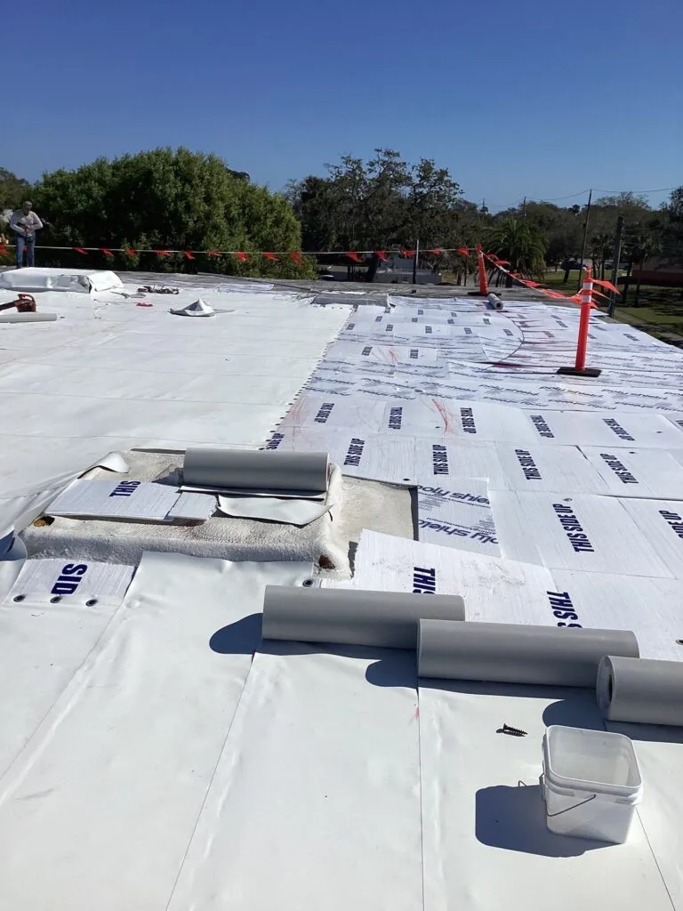 single-ply duro-last panels ready to be unrolled on a flat roof